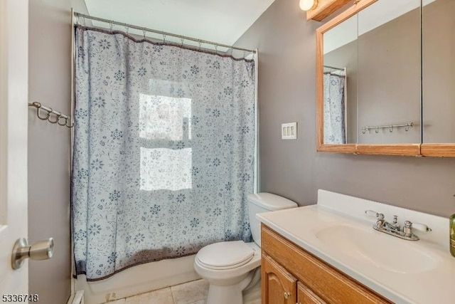 full bathroom with vanity, toilet, tile patterned flooring, and shower / bath combo