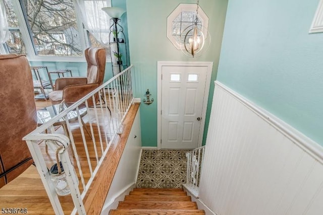 entryway featuring a chandelier