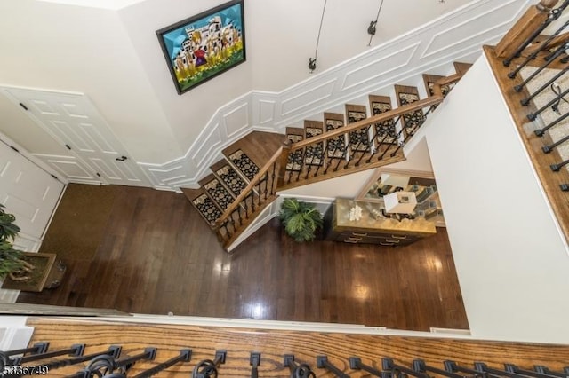 stairs with wood-type flooring