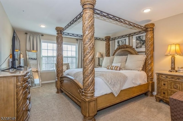 bedroom featuring light carpet