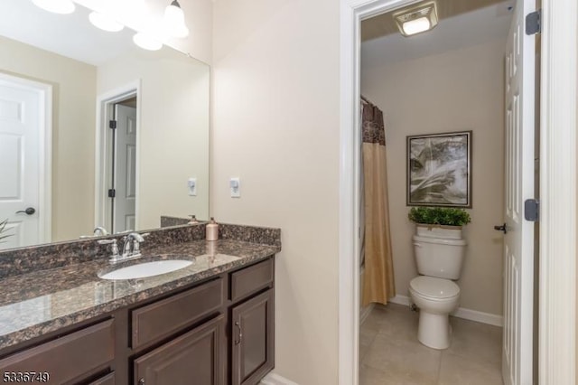 bathroom with a shower with curtain, tile patterned floors, vanity, and toilet