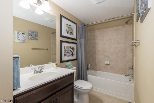 full bathroom featuring vanity, toilet, tile patterned flooring, and shower / bath combo