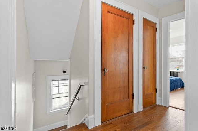 hallway with wood-type flooring