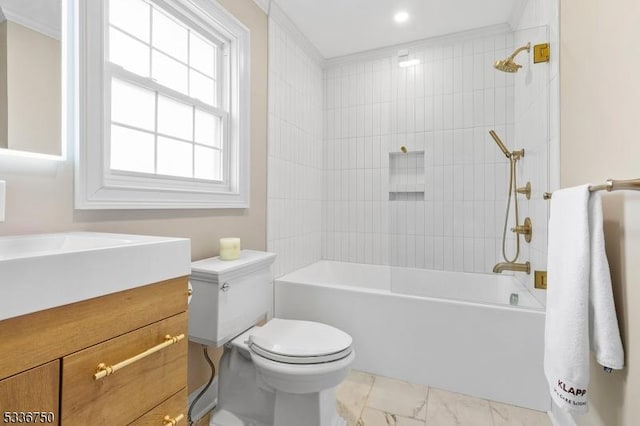 full bathroom with vanity, tiled shower / bath combo, and toilet