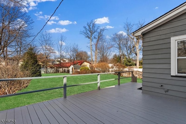 wooden terrace with a yard