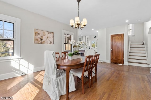 dining room featuring a notable chandelier and wood-type flooring