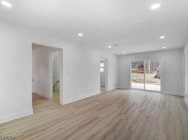 unfurnished room with light hardwood / wood-style floors