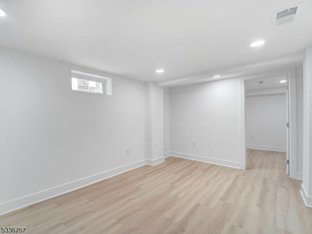 basement featuring light hardwood / wood-style flooring