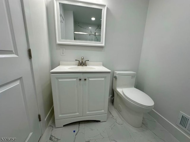 bathroom with vanity and toilet