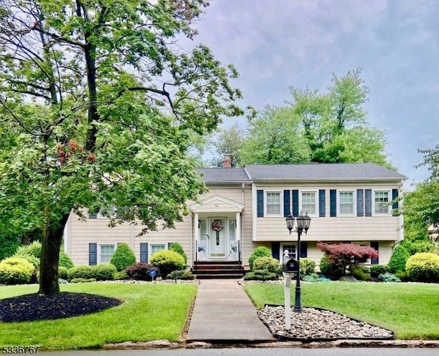 bi-level home with a front yard