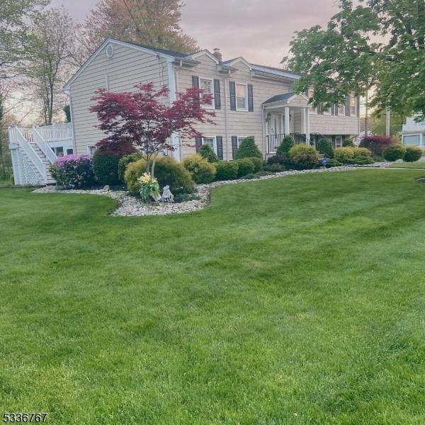 view of front of house with a yard