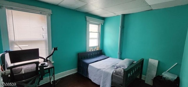 bedroom featuring a drop ceiling