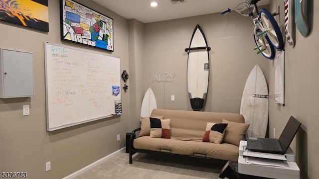 living area featuring light colored carpet