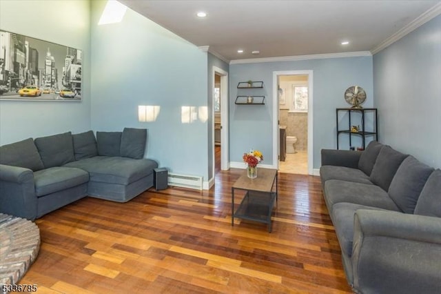 living room featuring crown molding, hardwood / wood-style floors, and baseboard heating