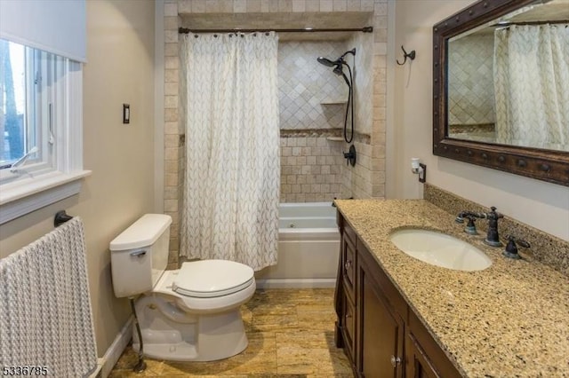 full bathroom featuring shower / tub combo with curtain, vanity, and toilet