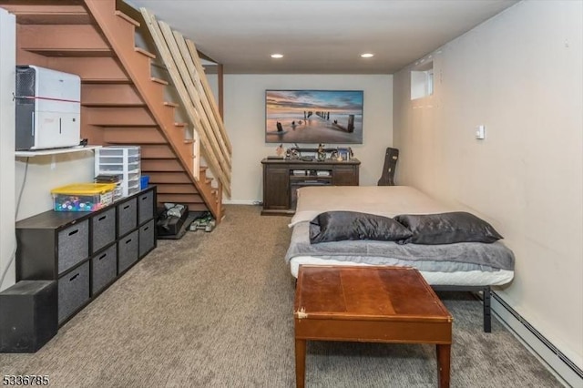 interior space featuring carpet flooring and a baseboard heating unit