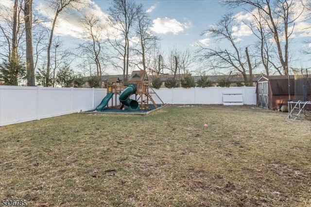 view of yard featuring a storage shed and a playground