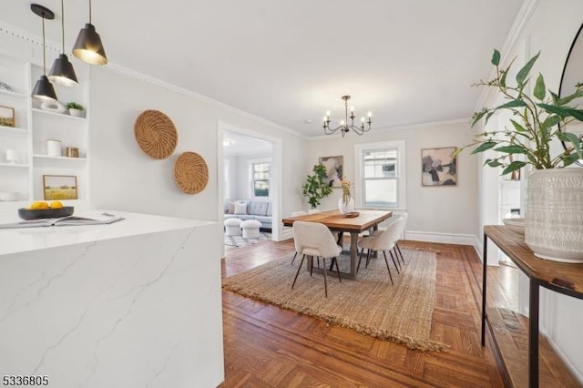 dining room with a chandelier, crown molding, and parquet floors