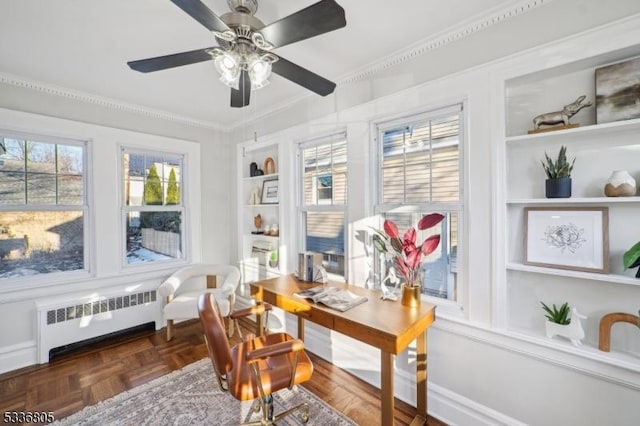 sunroom with radiator and ceiling fan