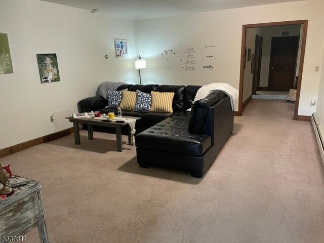living room featuring light colored carpet and baseboards