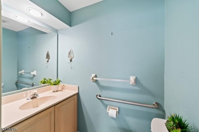 bathroom with vanity and toilet