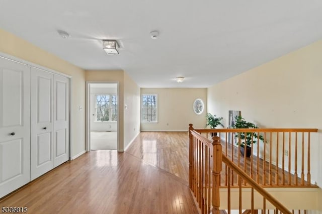 hall with light hardwood / wood-style floors