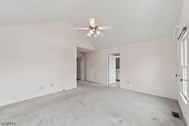 spare room with ceiling fan and high vaulted ceiling