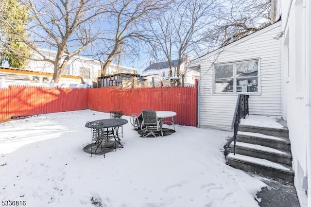 view of yard layered in snow