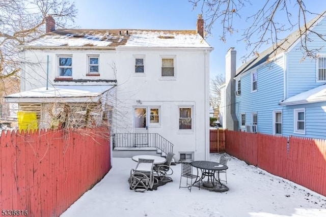 view of snow covered house