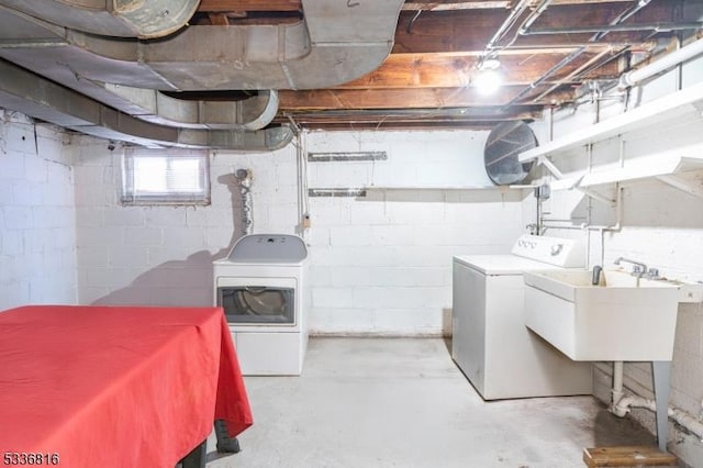 interior space featuring sink and washer and clothes dryer