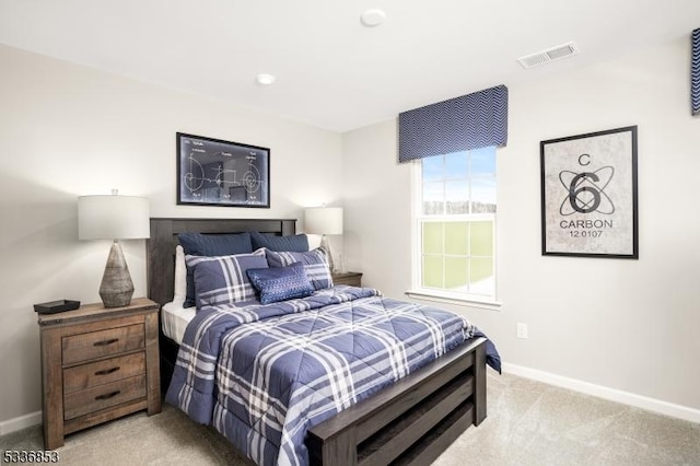 bedroom with light colored carpet