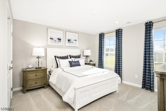 bedroom with light carpet