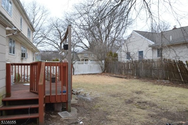 view of yard featuring a wooden deck