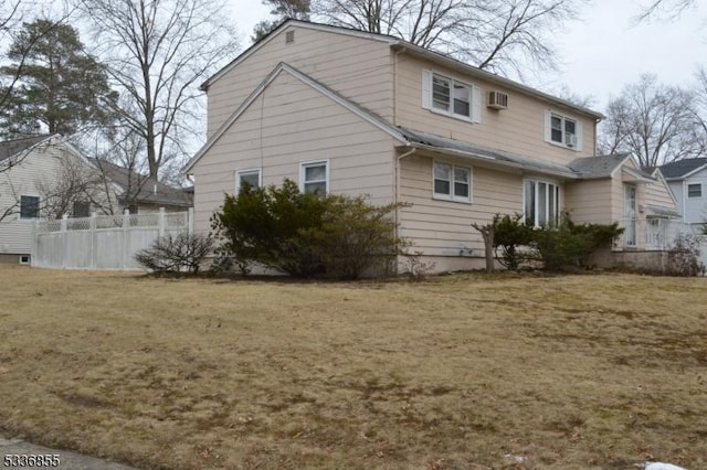 back of house with a yard