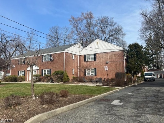 view of home's exterior featuring a yard