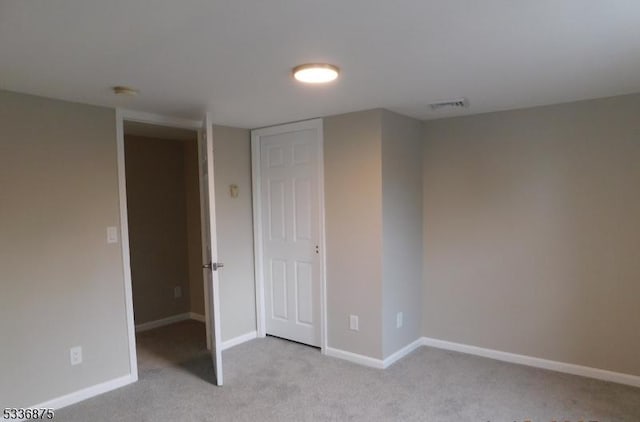 unfurnished bedroom with light carpet