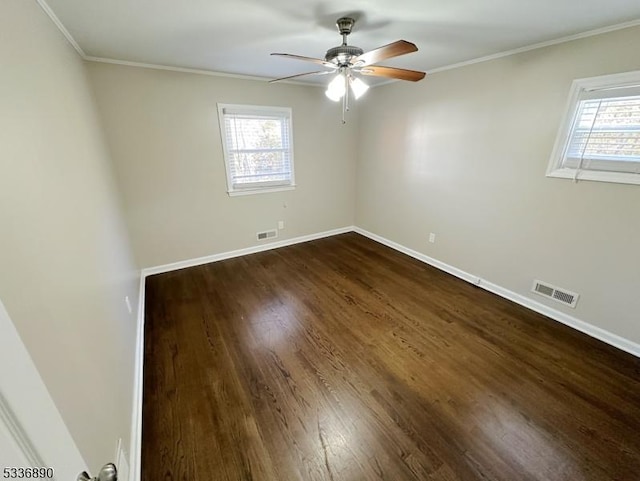 unfurnished room featuring crown molding, dark hardwood / wood-style floors, and ceiling fan