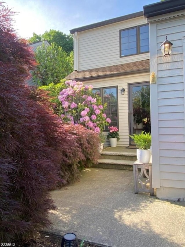 property entrance with a patio