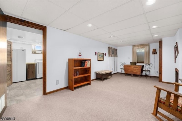 sitting room featuring baseboards, washer / dryer, recessed lighting, a paneled ceiling, and light colored carpet