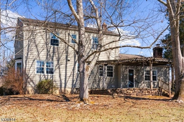 view of front of home featuring a chimney