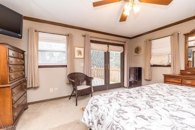 carpeted bedroom with crown molding, access to outside, french doors, and ceiling fan