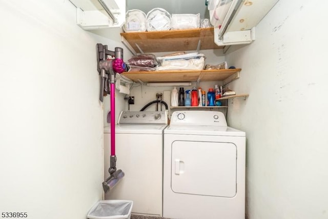 laundry room with washing machine and clothes dryer