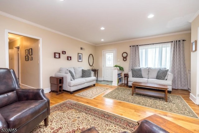 living room featuring crown molding and light wood-type flooring