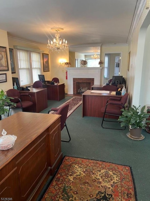 living room with a brick fireplace, crown molding, a chandelier, and carpet flooring