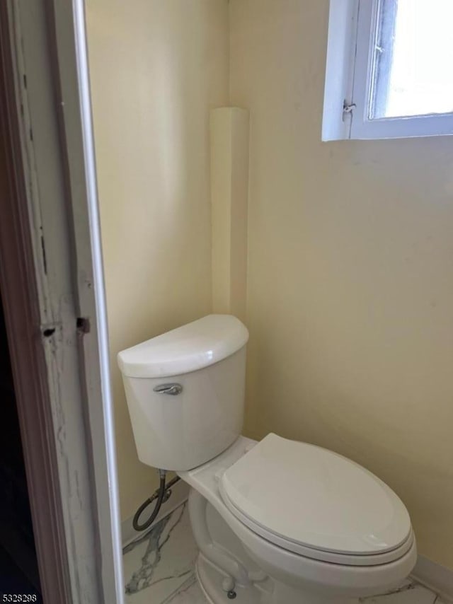 bathroom featuring toilet