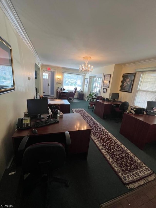 home office featuring an inviting chandelier, crown molding, and carpet