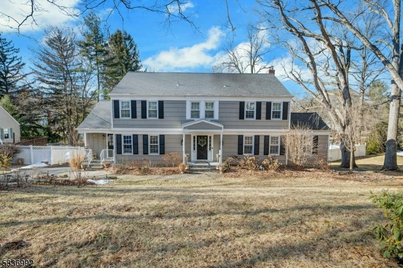 colonial home with a front yard