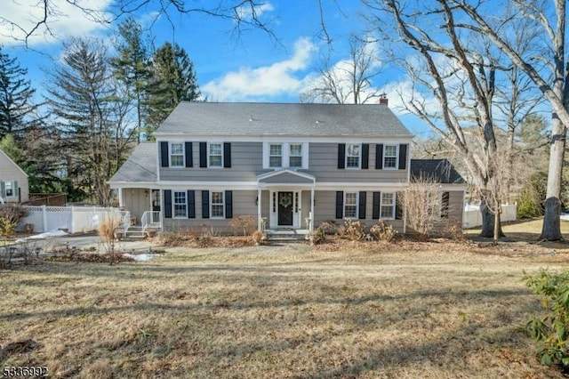 colonial home with a front yard