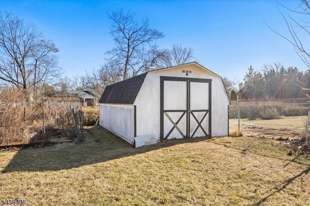 view of outbuilding with a yard