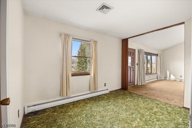 empty room with a baseboard radiator and carpet flooring